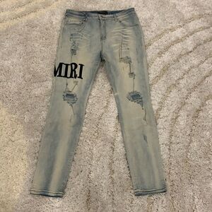 AMIRI Classic Leg Logo MX1 Bleached Clay Indigo Ripped Denim Jeans for Men 36